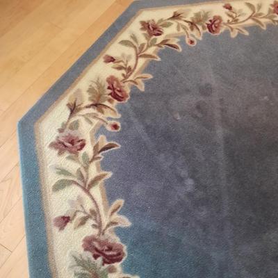 Octagon shaped blue and floral area rug