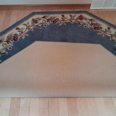 Octagon shaped blue and floral area rug