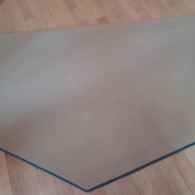 Octagon shaped blue and floral area rug