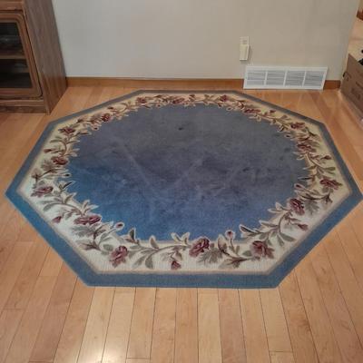 Octagon shaped blue and floral area rug