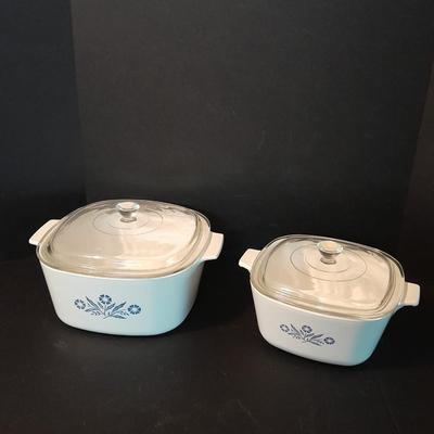 Two Corning ware casserole dishes with lids