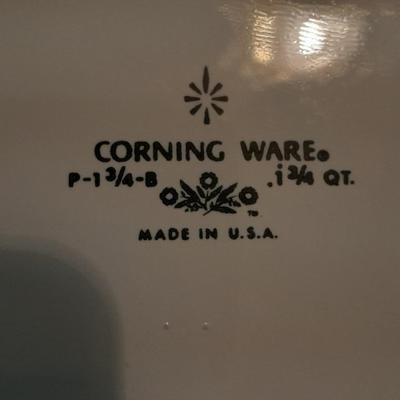 Two Corning ware casserole dishes with lids