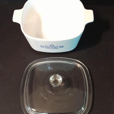 Two Corning ware casserole dishes with lids