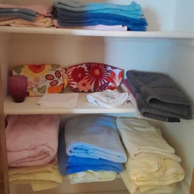 Mismatch bath towels, hand towels and washcloths, and two cosmetic bags