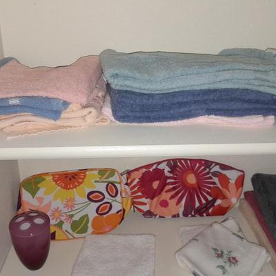 Mismatch bath towels, hand towels and washcloths, and two cosmetic bags
