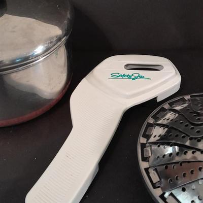 Revereware 1 Qt. saucepan with lid, Kitchen Utensils, and a Tools canister.