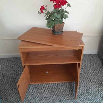 Sauder Furniture Swivel top TV / Storage cabinet with fake Geranium flower