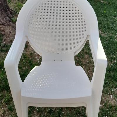 Three white plastic Patio chairs