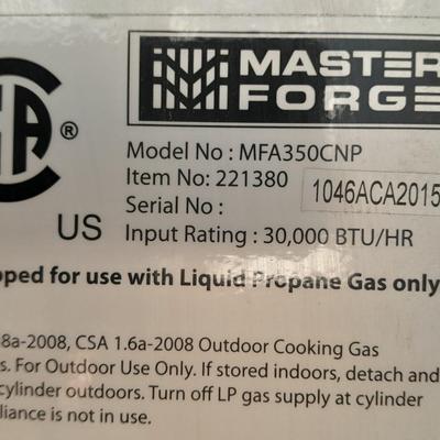 Master Forge Barbeque Grill with cleaning tools and propane tank
