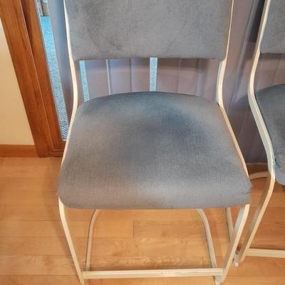 Two metal framed blue cushioned bar stools