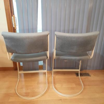 Two metal framed blue cushioned bar stools