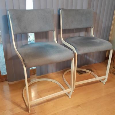 Two metal framed blue cushioned bar stools
