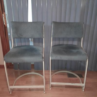 Two metal framed blue cushioned bar stools