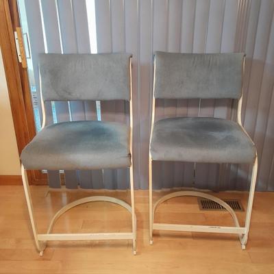 Two metal framed blue cushioned bar stools