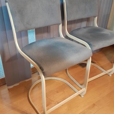 Two metal framed blue cushioned bar stools