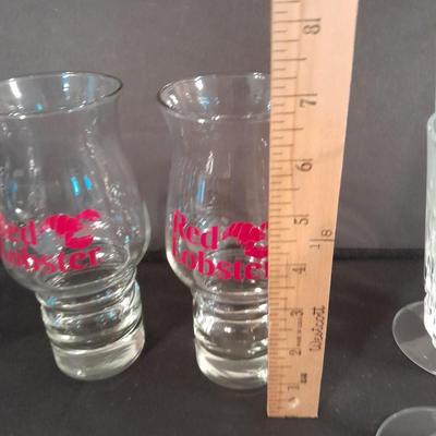 Two red Lobster glasses and stemware wine glasses