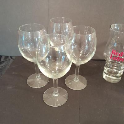 Two red Lobster glasses and stemware wine glasses