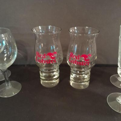 Two red Lobster glasses and stemware wine glasses