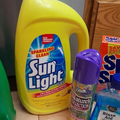 Dishwasher soap and other cleaning supplies full to almost full bottles