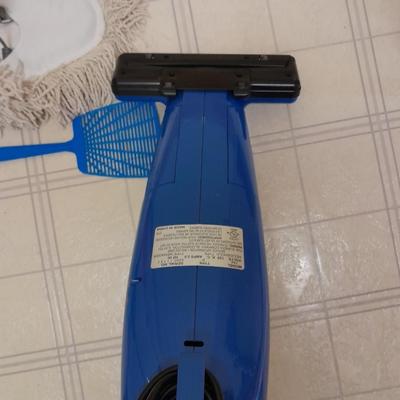 Cleaning tools, dusters, mops, and a Eureka Boss Vacuum broom