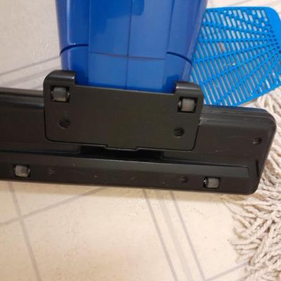 Cleaning tools, dusters, mops, and a Eureka Boss Vacuum broom