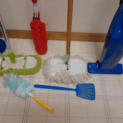 Cleaning tools, dusters, mops, and a Eureka Boss Vacuum broom