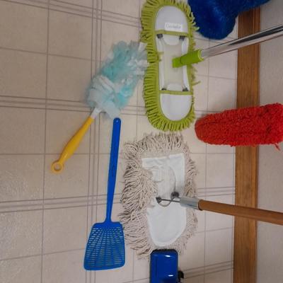 Cleaning tools, dusters, mops, and a Eureka Boss Vacuum broom