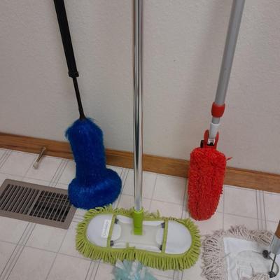 Cleaning tools, dusters, mops, and a Eureka Boss Vacuum broom