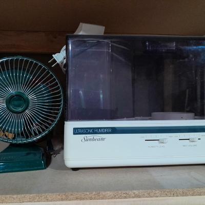 Small tabletop green colored fan and Sunbeam Ultrasonic Humidifier