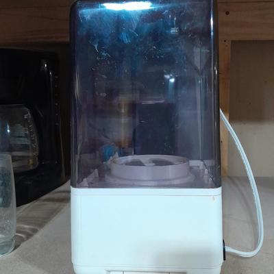 Small tabletop green colored fan and Sunbeam Ultrasonic Humidifier