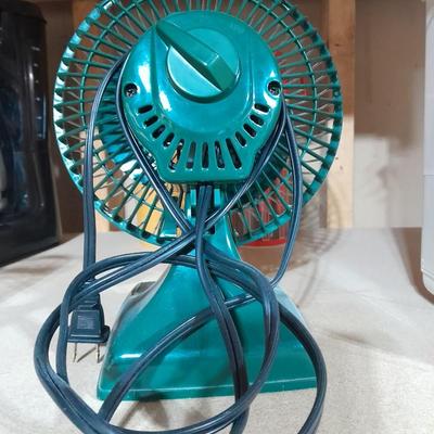 Small tabletop green colored fan and Sunbeam Ultrasonic Humidifier