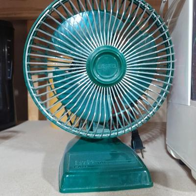 Small tabletop green colored fan and Sunbeam Ultrasonic Humidifier