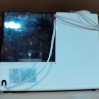 Small tabletop green colored fan and Sunbeam Ultrasonic Humidifier
