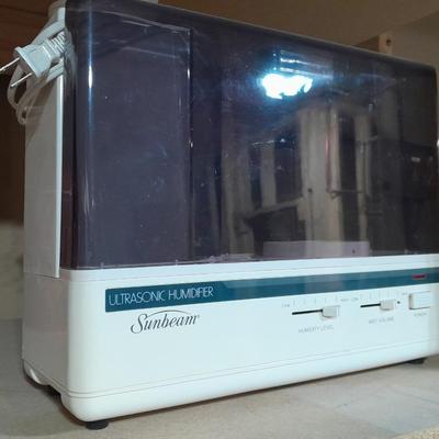 Small tabletop green colored fan and Sunbeam Ultrasonic Humidifier