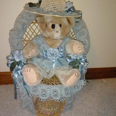 Teddybear in a wicker cane back chair, with handmade crocheted Doilies.