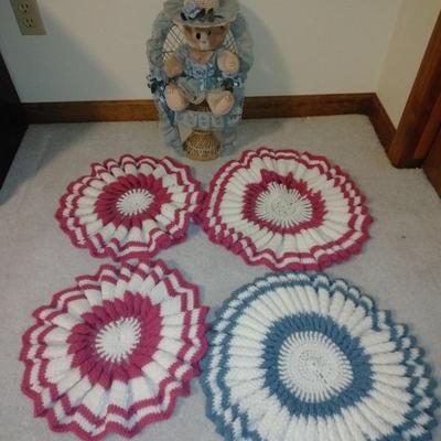 Teddybear in a wicker cane back chair, with handmade crocheted Doilies.