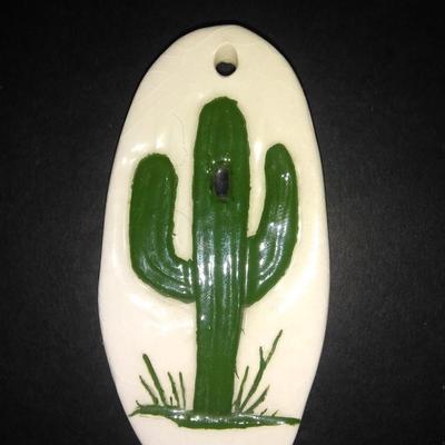 Framed Numbered and Signed "canyon lands" artwork with ceramic cactus