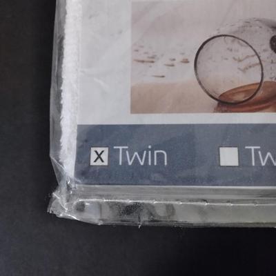 New Safe Rest Premium Mattress protector packaged marked twin sized