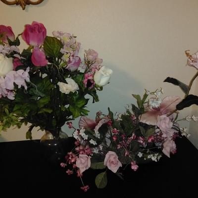 Two fake bouquet flowers in planters