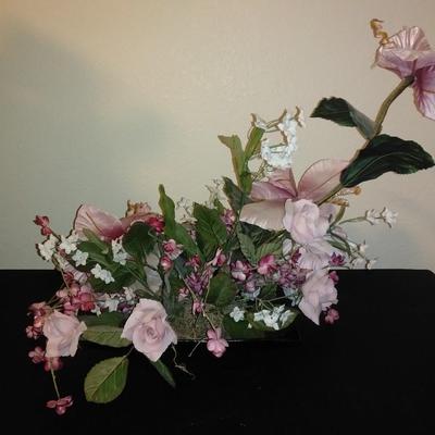 Two fake bouquet flowers in planters
