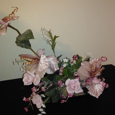 Two fake bouquet flowers in planters