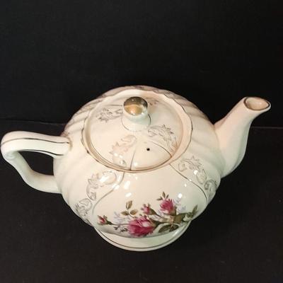 Lefton porcelain Angel, Teapot, Cup and saucer, and a silver-colored bell
