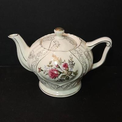 Lefton porcelain Angel, Teapot, Cup and saucer, and a silver-colored bell