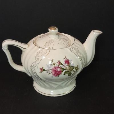 Lefton porcelain Angel, Teapot, Cup and saucer, and a silver-colored bell
