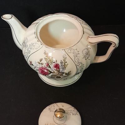 Lefton porcelain Angel, Teapot, Cup and saucer, and a silver-colored bell