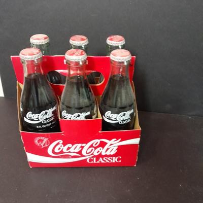 1996 Coca-Cola Classic full 6 pack bottles, and Coca-Cola lidded candy canister