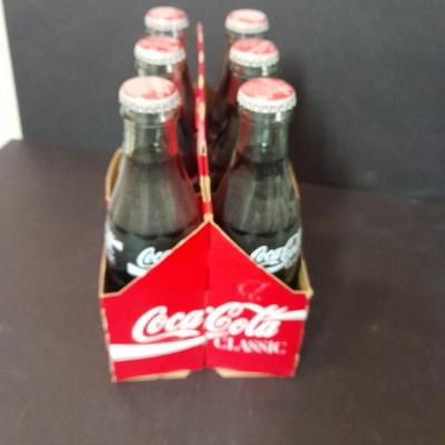 1996 Coca-Cola Classic full 6 pack bottles, and Coca-Cola lidded candy canister