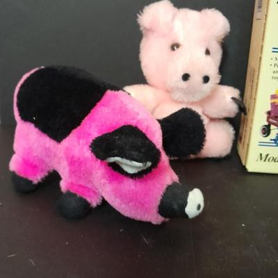 Radio Flyer wagon model and several vintage plush animals