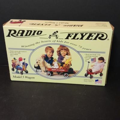 Radio Flyer wagon model and several vintage plush animals