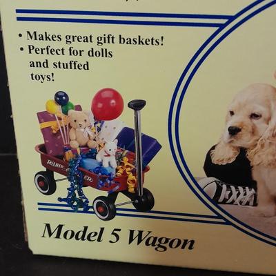 Radio Flyer wagon model and several vintage plush animals